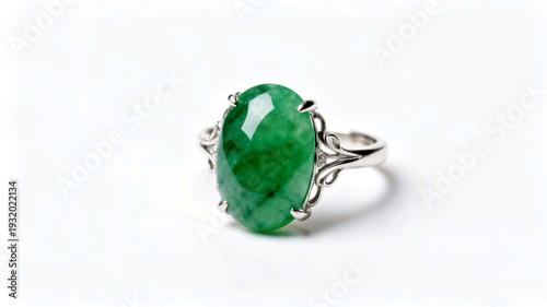 Wallpaper Mural Elegant sterling silver ring featuring a polished oval green jade cabochon. High-quality jewelry photography with intricate filigree detail on a clean white surface. Torontodigital.ca