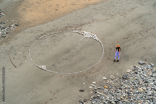 Aerial view of a woman having fun with art in nature