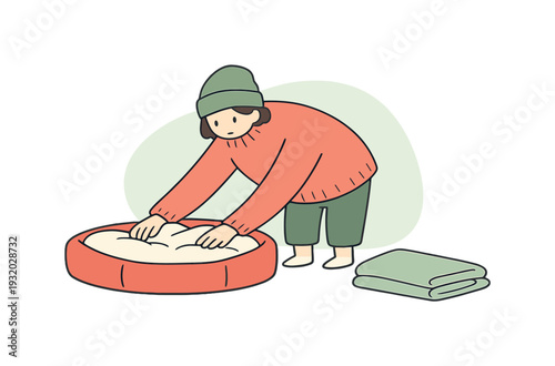 Cozy person prepares a pet bed on the floor, fluffing cushions and smoothing fabric while a blanket folds nearby. | pet bed, pet