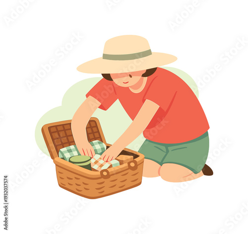 Person in a hat packing a picnic basket with food and drinks for an outdoor excursion