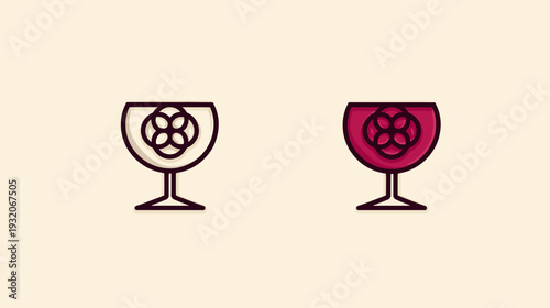 Two wine glasses side-by-side one with a floral emblem, empty, and the other filled with red liquid