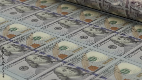 Close-up loop animation of 100 dollar banknotes moving through printing press, symbolizing inflation, monetary policy and economic pressure. Ideal for investment, fintech and corporate media.