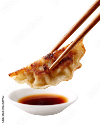Japanese fried gyoza dumpling with chopsticks and soy sauce, isolated on white, png