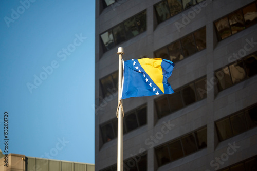 Obraz na plátne The Bosnian flag on a flag pole at Toronto City Hall's Nathan Phillips Square
