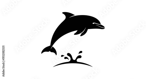 A sleek black silhouette of a dolphin leaping above ocean waves