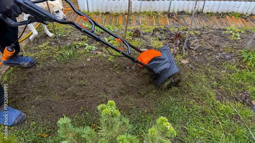 Εκτύπωση καμβά Electric tiller churning earthy symphony, prep for garden awakening; Slavic Spri