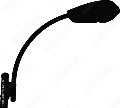 A person dwarfed by a large microphone