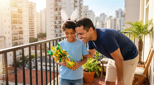 Happy father and son enjoying Easter together on balcony with city view