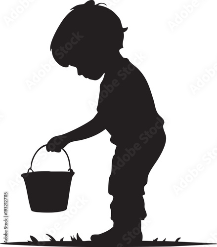 Silhouette of a child bending down to pick up a bucket in a grassy field on a sunny day