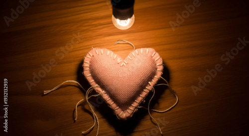 Heart shaped object with strings attached.