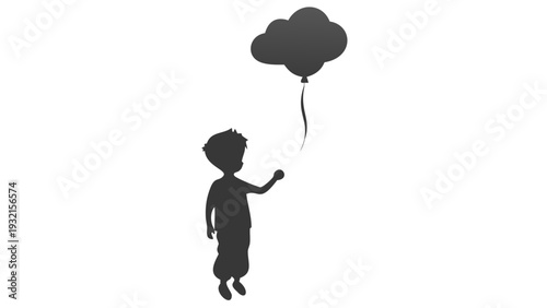 Young boy holding balloon in joyful pose