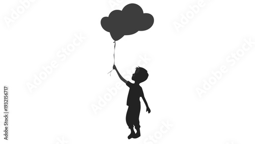 Little boy holding a cloud shaped balloon in his hand