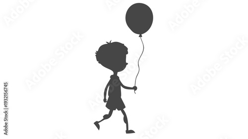 Little boy walking with a balloon in hand happily