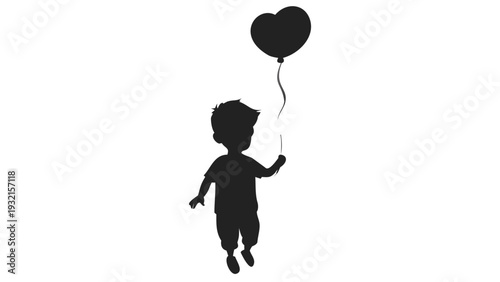 Little boy running with heart shaped balloon in hand happily