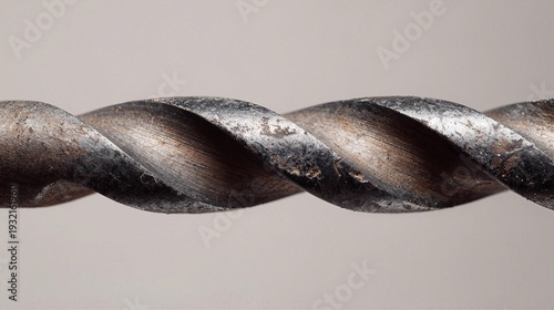 Closeup of a single drill bit, clean composition ample negative space