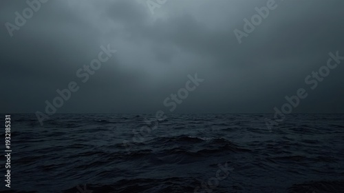 A simple horizontal line dividing a dark gray sky and a black sea