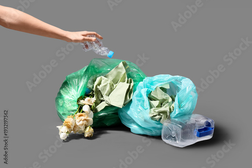 Woman throwing plastic bott...