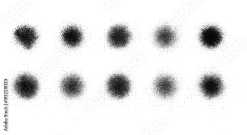 Eight black ink splatter spots