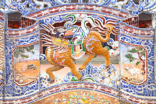 Beautiful Decoration on a Wall of a Vietnamese Temple in Hoi An, Vietnam