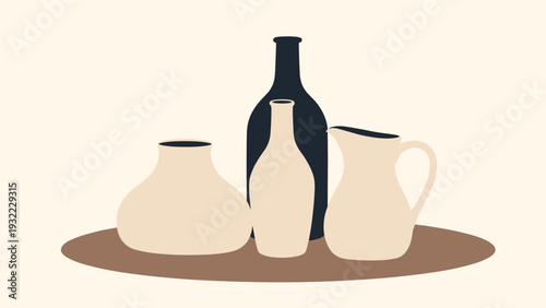 Still life composition features three different ceramic pitchers and a dark glass bottle on a simple brown oval table.