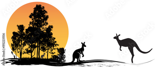 Kangaroo silhouette at sunset in Australian outback with gum trees