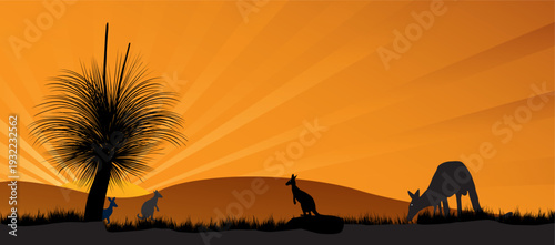Kangaroo silhouettes graze and sit against a warm orange sunset over rolling outback hills, tall grass and a distinctive grass tree, evoking calm, wilderness and iconic Australian nature scenery.