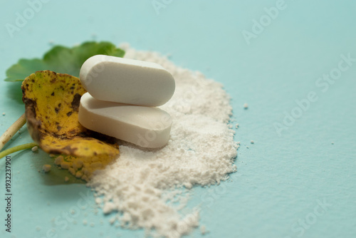 Minimal pharmaceutical concept with tablets and organic texture