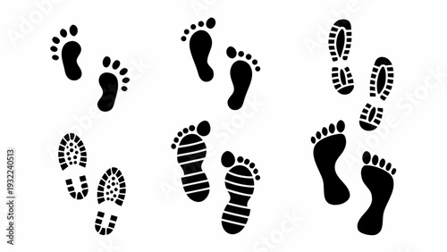 Variety of black footprints and shoe prints on a white background