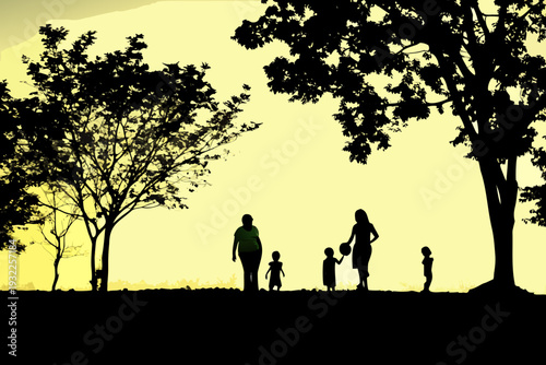 A family silhouetted against a vibrant golden sunset landscape
