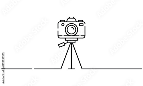 Simple line art illustration of a camera mounted on a tripod with a remote shutter release attached to it for stable photography.
