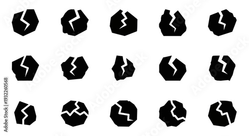 Collection of black torn paper shapes with ripped edges and cracks on a white background, illustrating damage, viewed from directly above