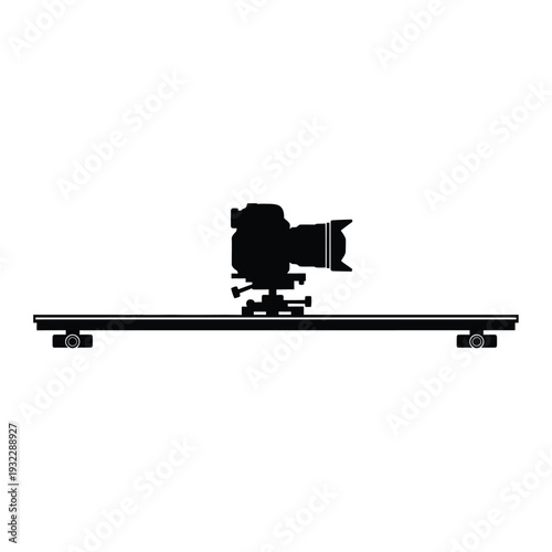 Black camera on a dolly track silhouette