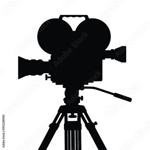 Black camera on tripod silhouette recording