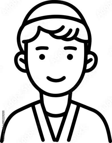 Smiling boy wearing traditional Muslim clothing and kufi cap