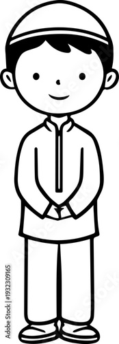 Smiling boy wearing traditional Muslim clothing and kufi cap