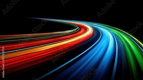 Colorful light streaks accelerating on black background expressing technology