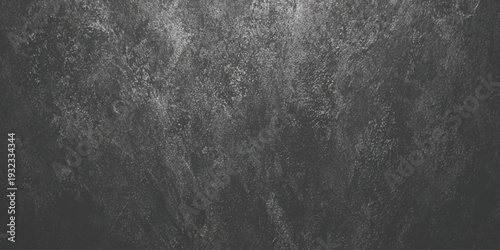 A dark textured background showcasing a gritty monochrome pattern with subtle variations in shading and tone