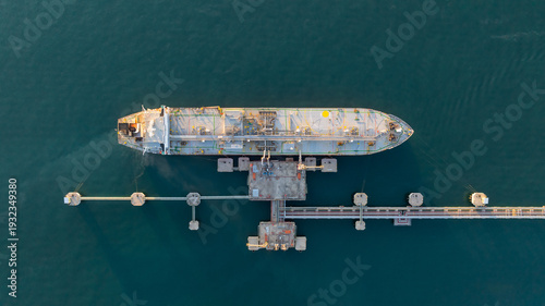 Aerial view oil and gas ship tanker vessel loading unloading in oil terminal station refinery, Global business import export logistic transport sea freight cargo tanker, Oil gas tanker ship at port.