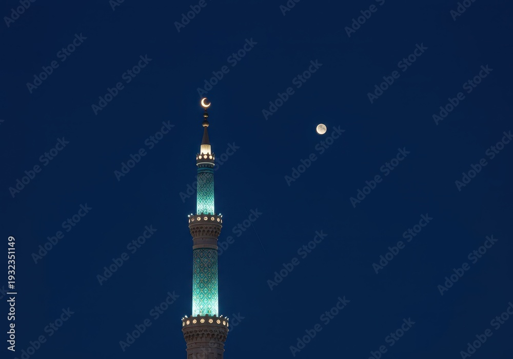 Obraz premium Stunning illuminated minaret tower against a dark blue evening sky, adorned with crescent moon lights, marking a peaceful religious holiday celebration, moon, tall, structure