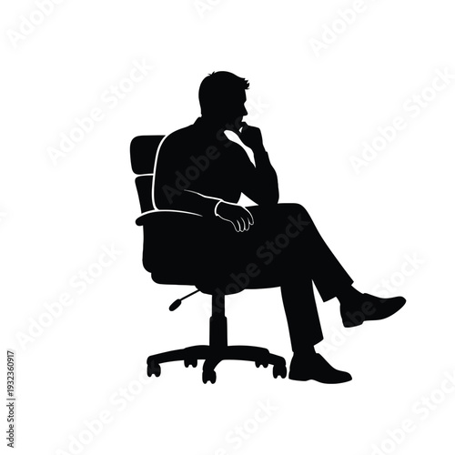 Businessman sitting in office chair looking thoughtful and relaxed