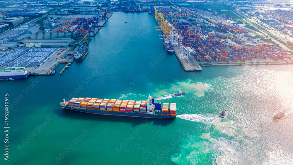 Naklejka premium Large heavy lift cargo ship transporting massive wind turbine blades across the deep blue ocean. Global logistics for renewable energy and maritime shipping industry business concept.