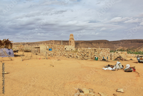 The ancient mosque of the local village close old city Ouadane in Sahara desert, Mauritania