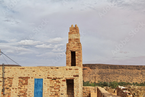 The ancient mosque of the local village close old city Ouadane in Sahara desert, Mauritania