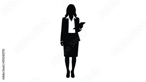 Silhouette of a businesswoman holding a tablet facing slightly to the side