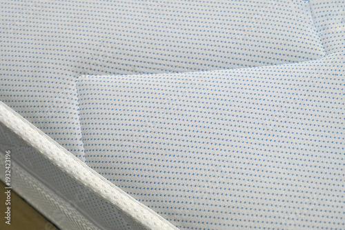 Принти на полотні Close-up a new white mattress. Bed edge.