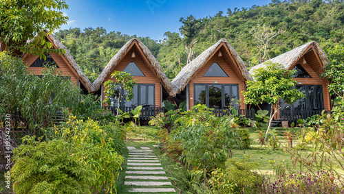 Wooden holiday bungalows blending with lush green landscape in huyn cat hi, hi phong