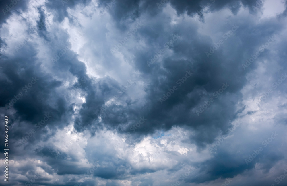 Fototapeta premium Dark sky with stormy clouds. Dramatic sky rain,Dark clouds before a thunder-storm,clouds before rain