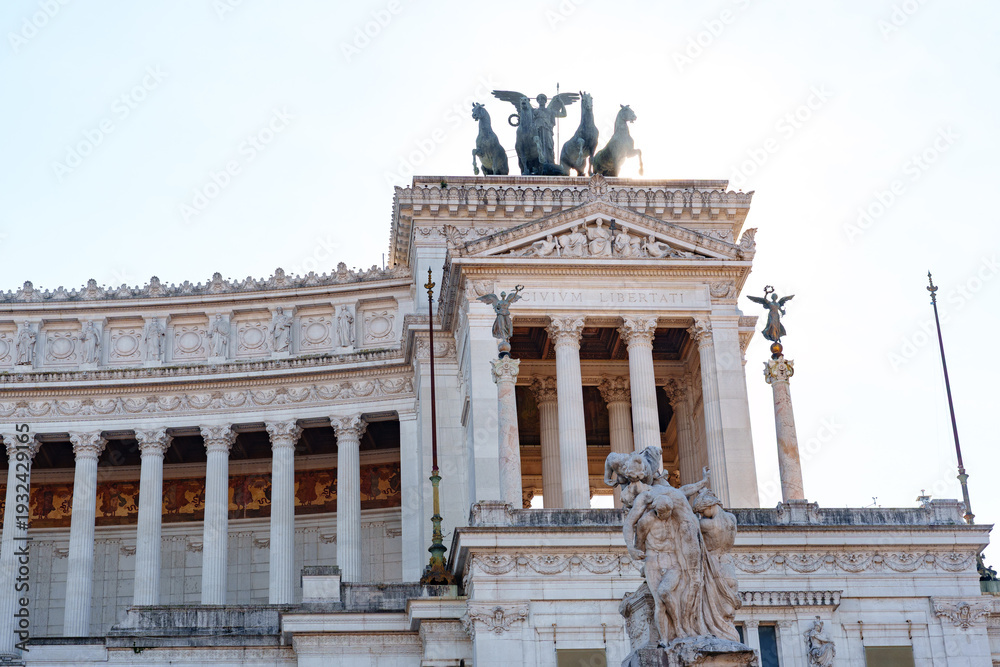 Naklejka premium View of a historic building with sculptures in Rome during the day