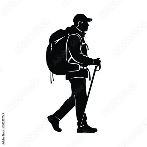 Hiker with backpack walking through wilderness with trekking poles