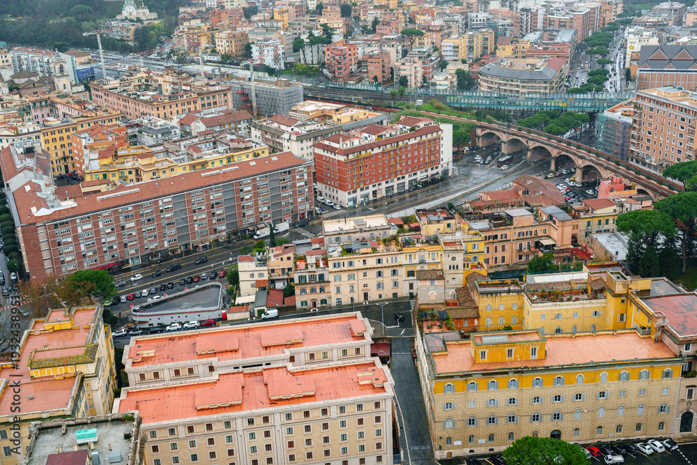 Fototapeta premium City view of buildings in Rome with roads and bridges under cloudy sky